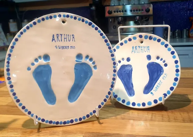 A ceramic clay imprint keepsake made in the Pictura café