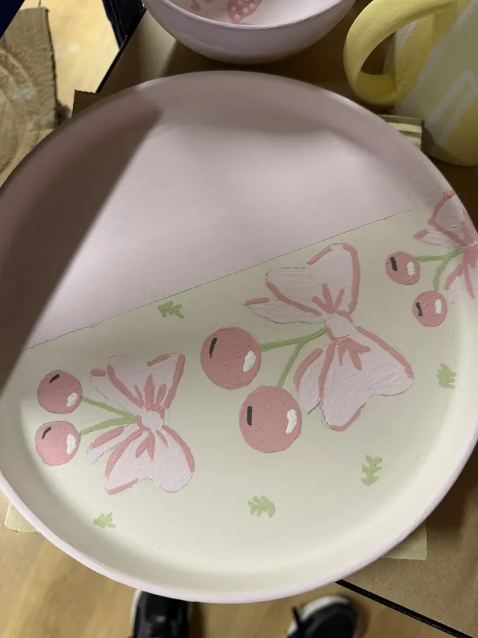 Glazed and fired painted pottery