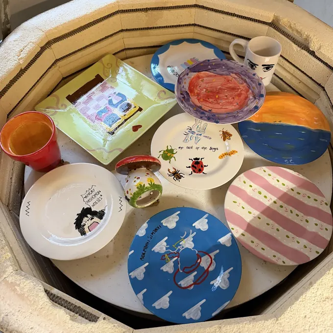 A kiln full of freshly fired, glossy painted pottery