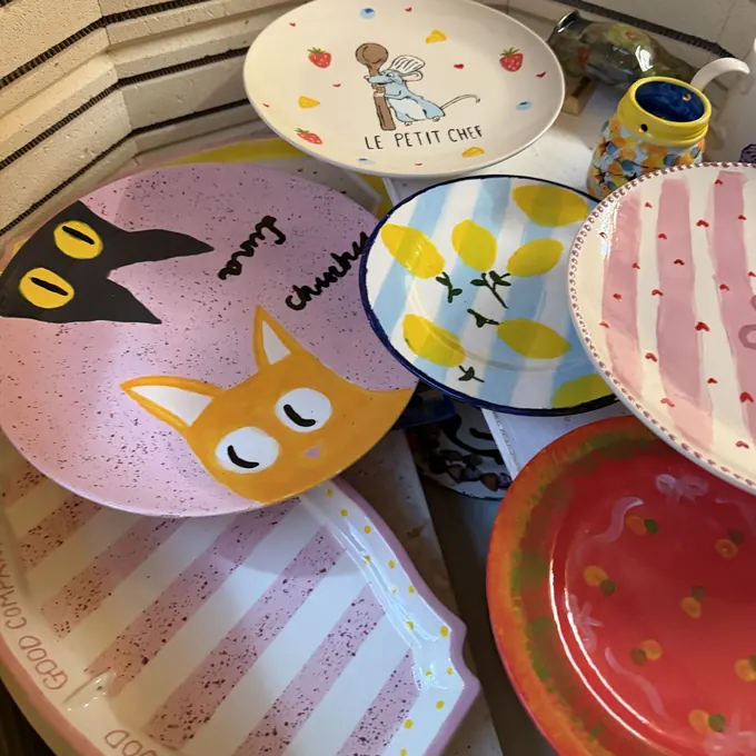 Freshly fired, glossy painted plates and pottery inside the Pictura kiln