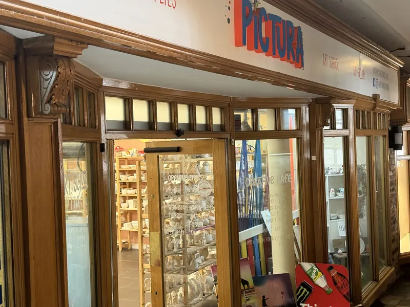 The Pictura shopfront on Eastgate Row North, with the Pictura sign above the windows